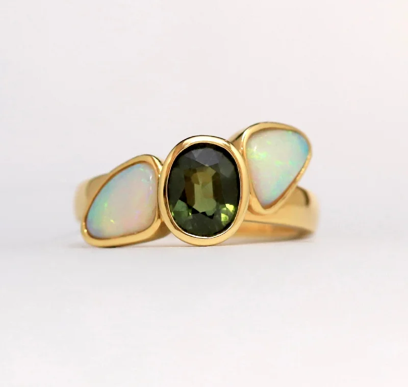 Emerald Gemstone Rings with Diamond - Encrusted HalosEmerald Gemstone Rings with Diamond - Encrusted Halos18ct Yellow Gold Oval Cut Tourmaline and Trillian Opal sides