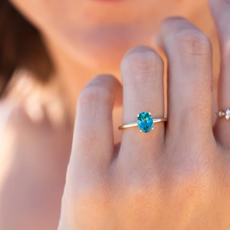 Sapphire Gemstone Rings in a Victorian - Inspired DesignSapphire Gemstone Rings in a Victorian - Inspired DesignThe Alice Ring | Oval Lab Grown Paraiba Spinel Four Claw Solitaire