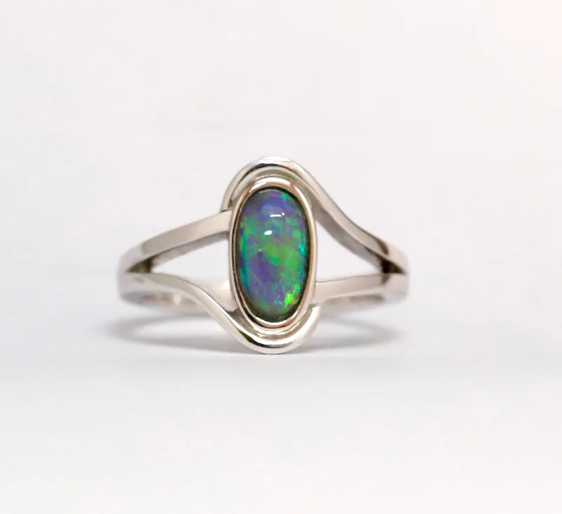 Topaz Gemstone Rings with a Faceted Cut and Shimmering EffectTopaz Gemstone Rings with a Faceted Cut and Shimmering Effect18ct White Gold Oval Cut Black Opal Ring